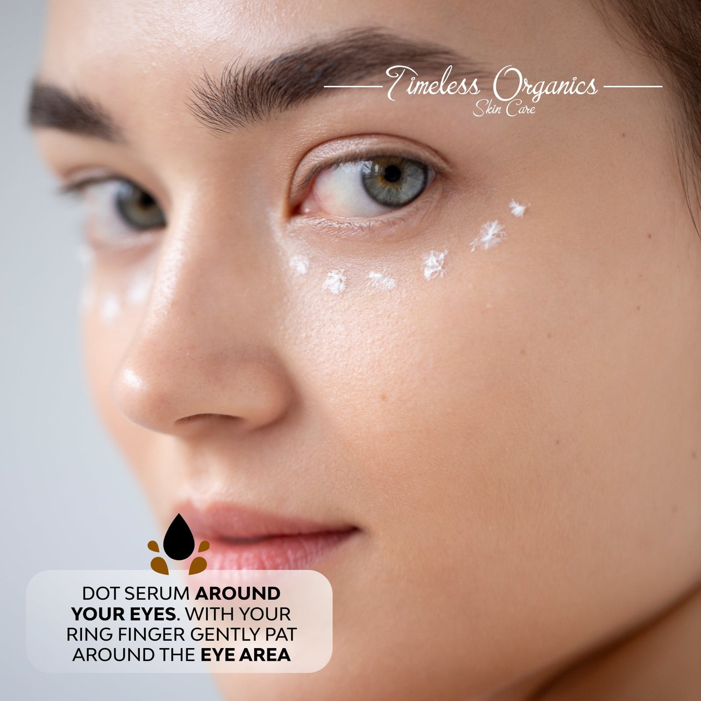 Woman with eye area serum dotted on under-eye and eyelid area
