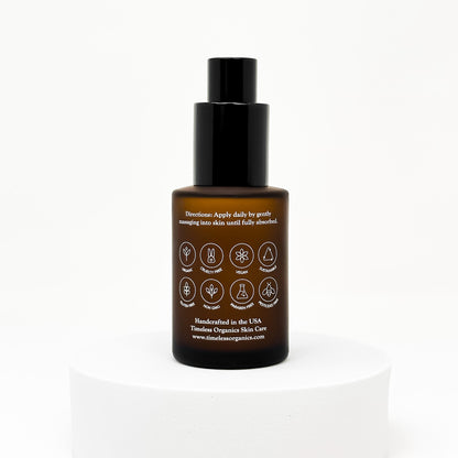 Glow serum bottle with black pump, brown glass, back label side facing camera.