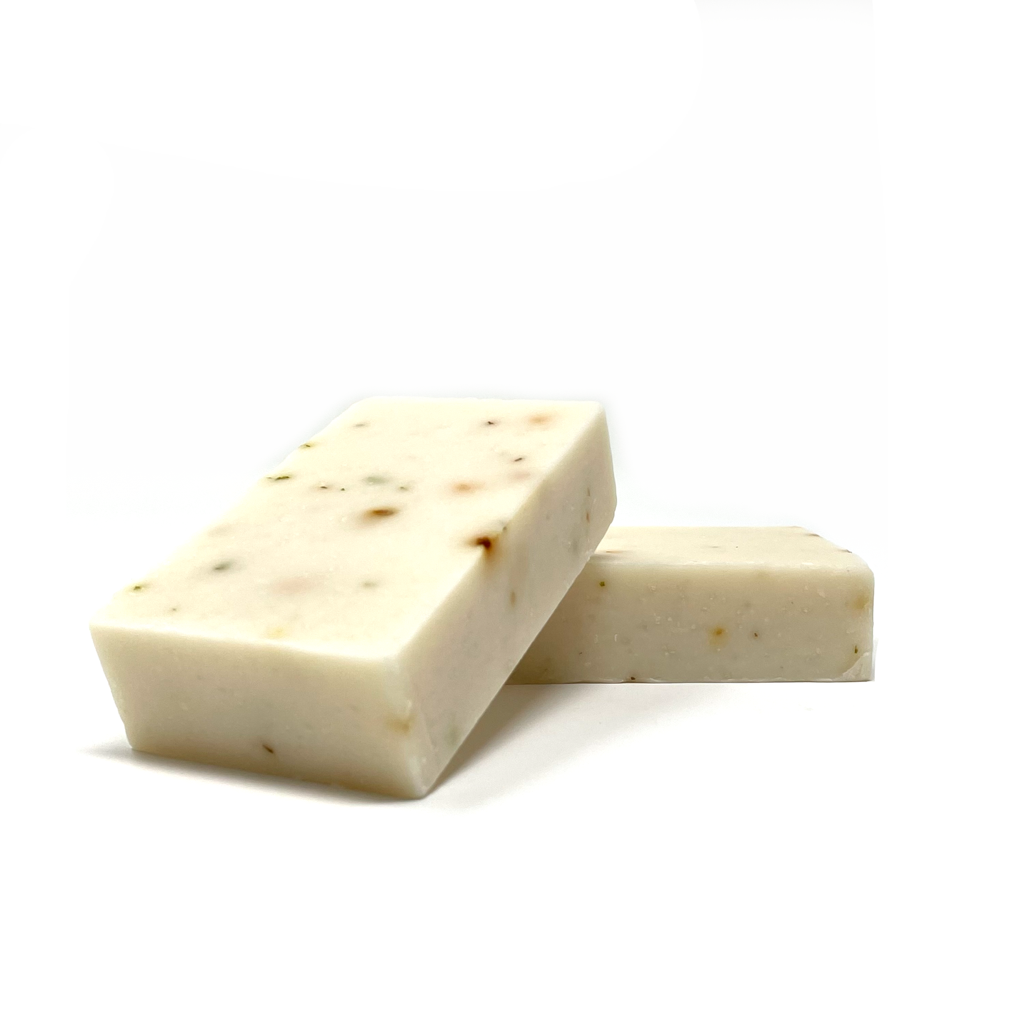Clarifying bar soap, pale cream with scattered dark specks