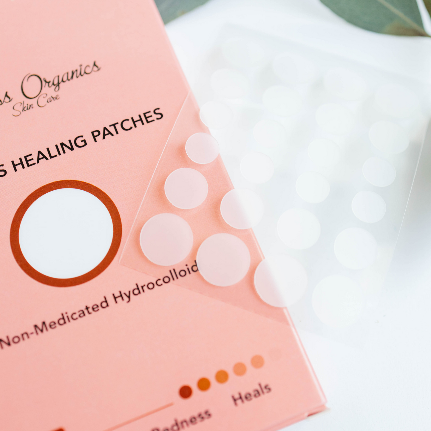 Acne patch package with round hydrocolloid patches, pink box and white patches