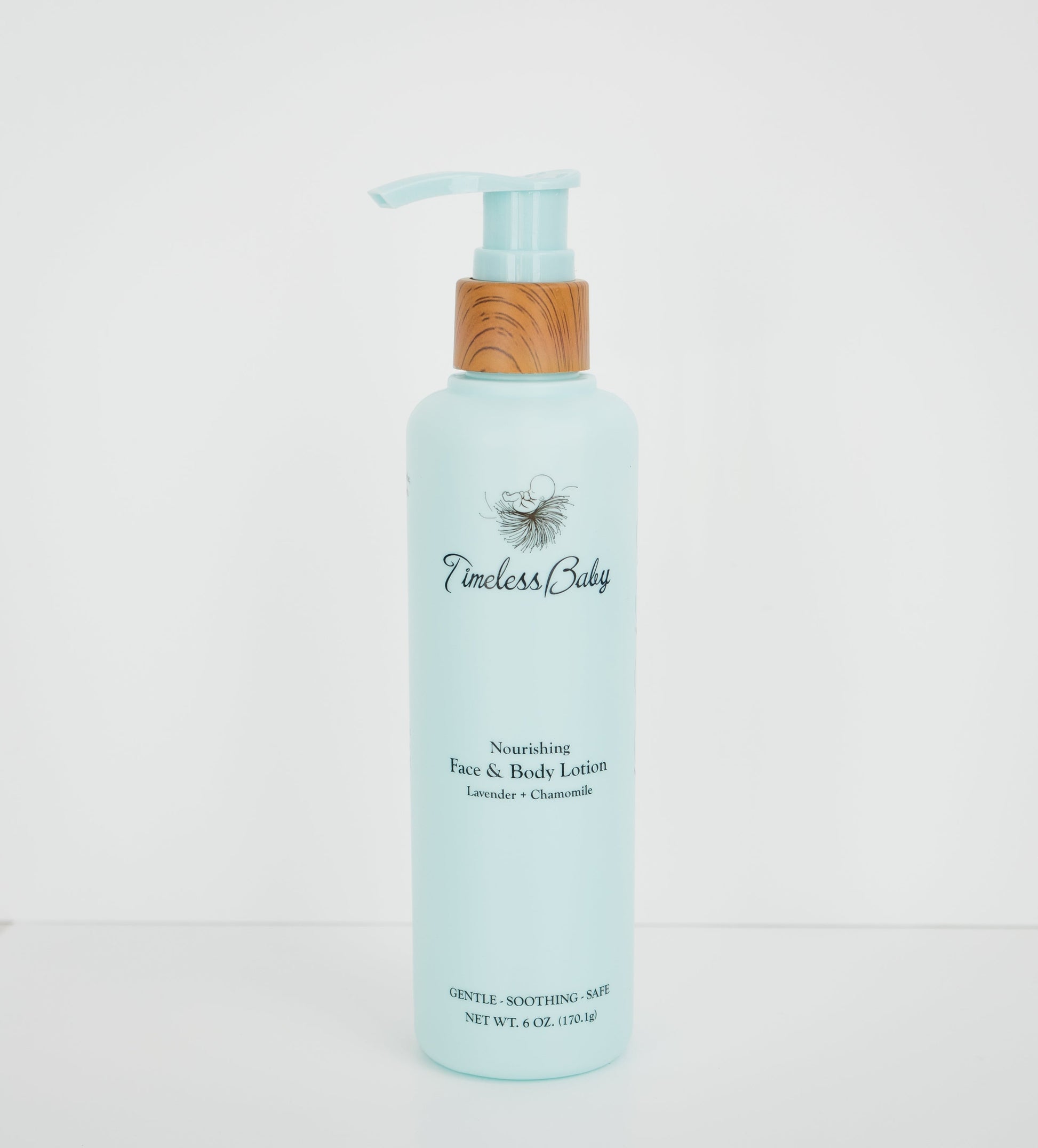 Baby face and body lotion bottle, light blue with pump, lavender and chamomile label.