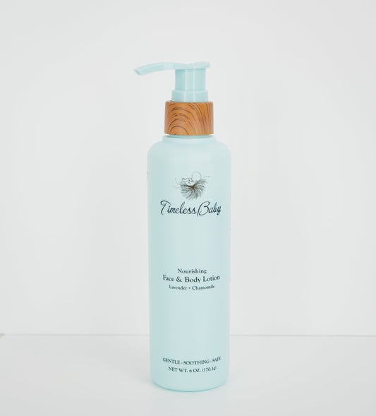 Baby face and body lotion bottle, light blue with pump, lavender and chamomile label.