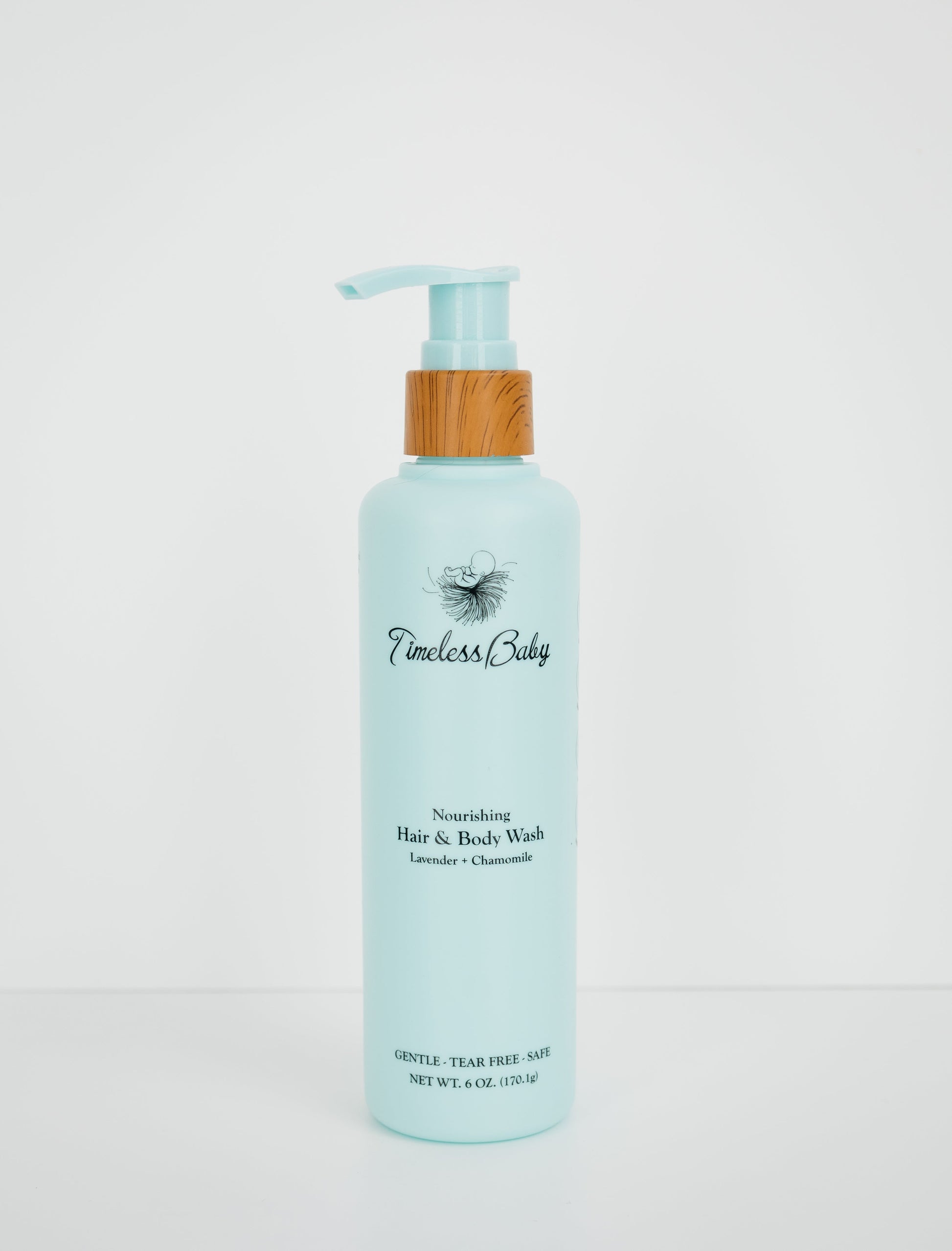 Light blue baby hair & body wash bottle with wooden pump and flip-top dispenser