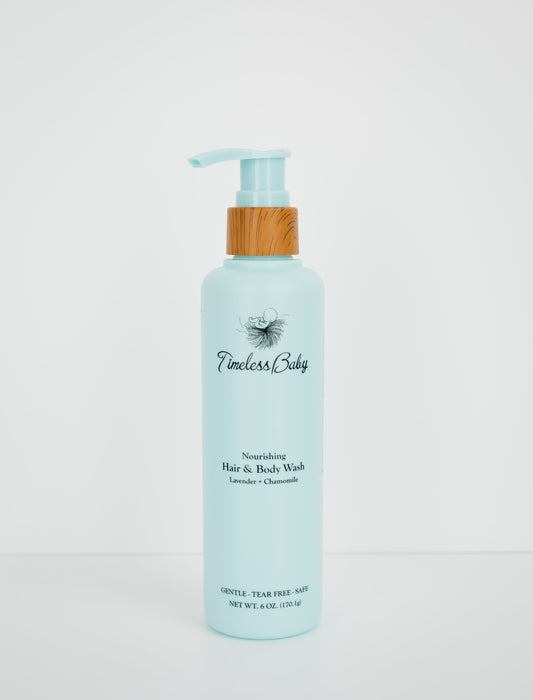 Light blue baby hair & body wash bottle with wooden pump and flip-top dispenser