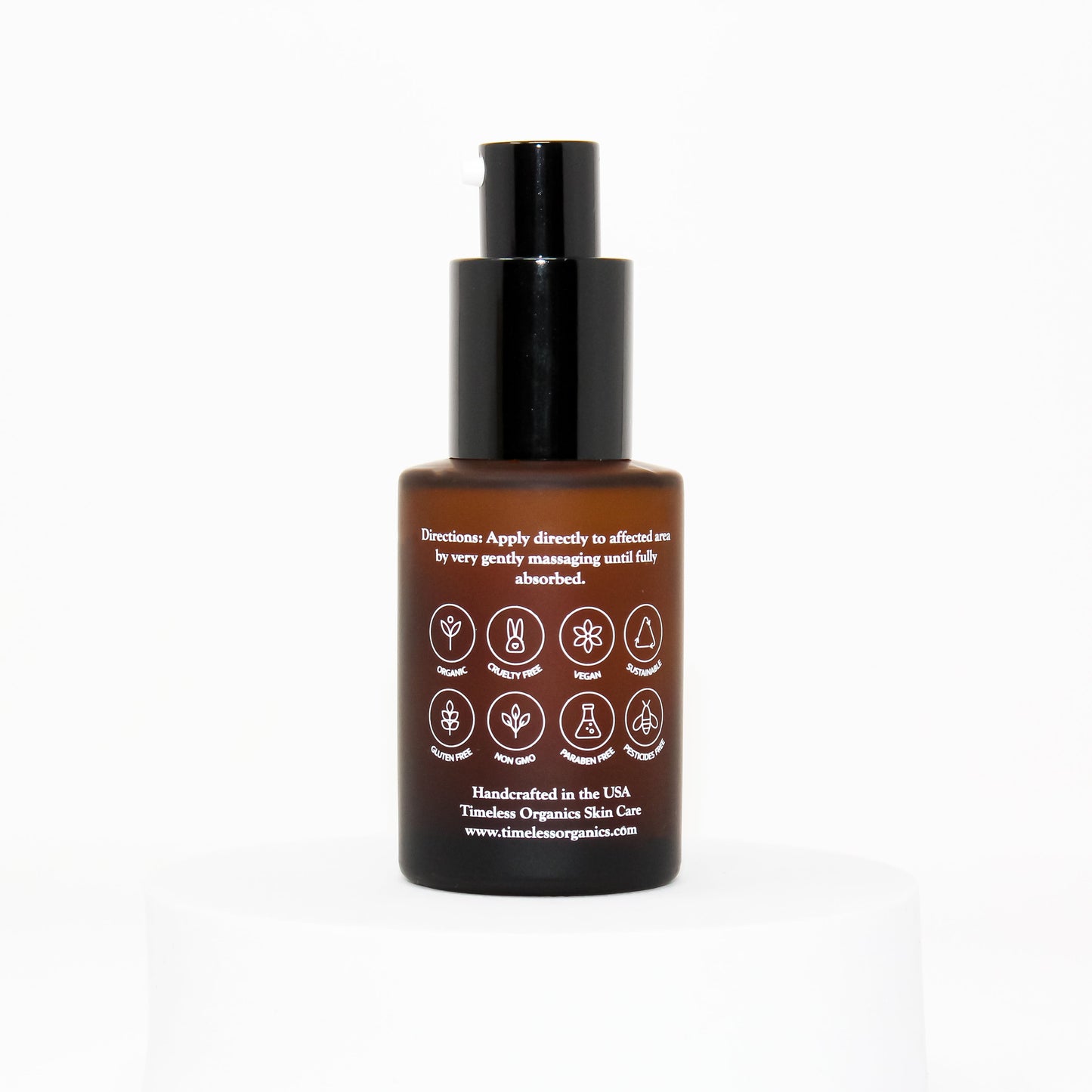 Oil-free spot treatment bottle, dark brown with black cap and ingredient icons