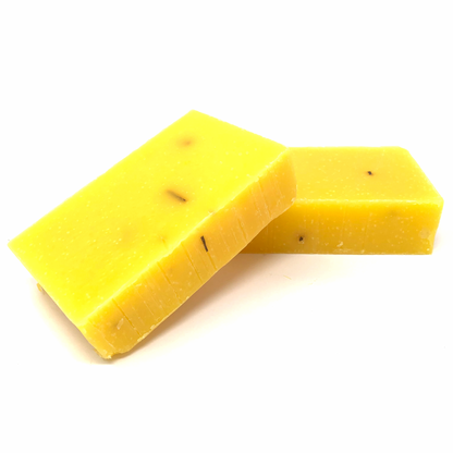 Anti-aging bar soap, yellow-gold with visible specks, cut block bars