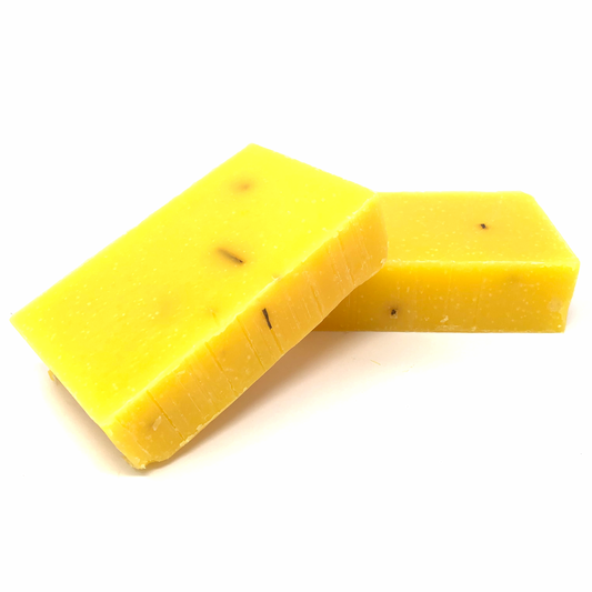 Anti-aging bar soap, yellow-gold with visible specks, cut block bars