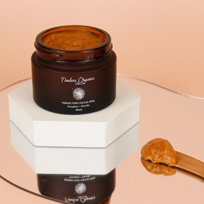 Opened pumpkin facial peel jar with amber gel inside and lid shown off.
