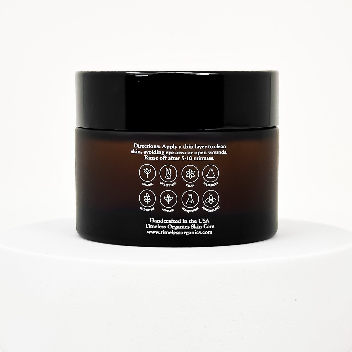 Facial peel jar back label with directions and ingredient icons, glossy black cap.