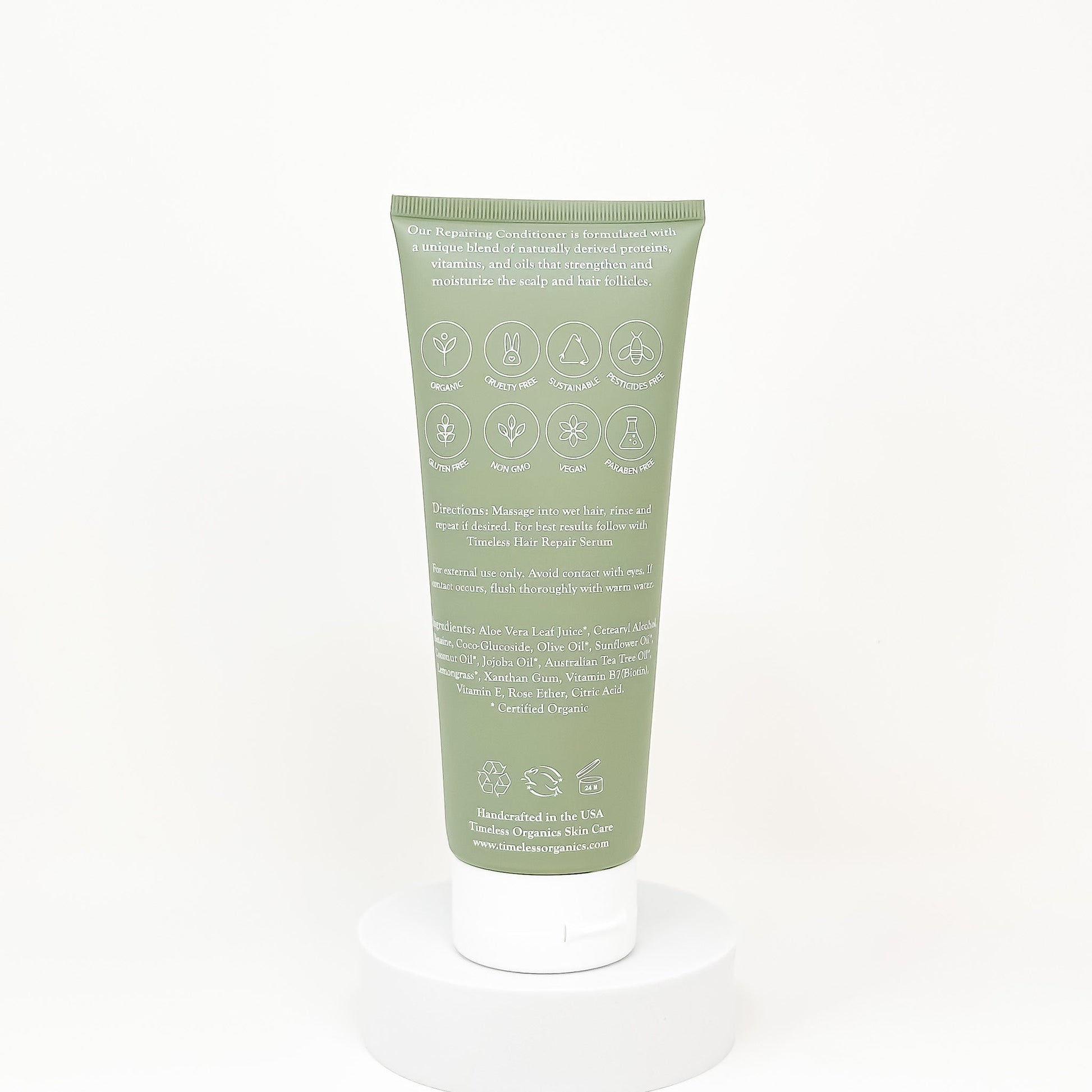 Back of green conditioner tube with ingredient icons and product details text