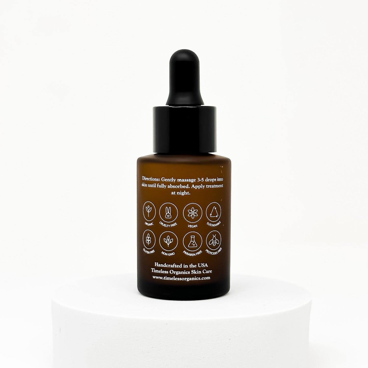 Retinol treatment serum bottle with black dropper cap and back label