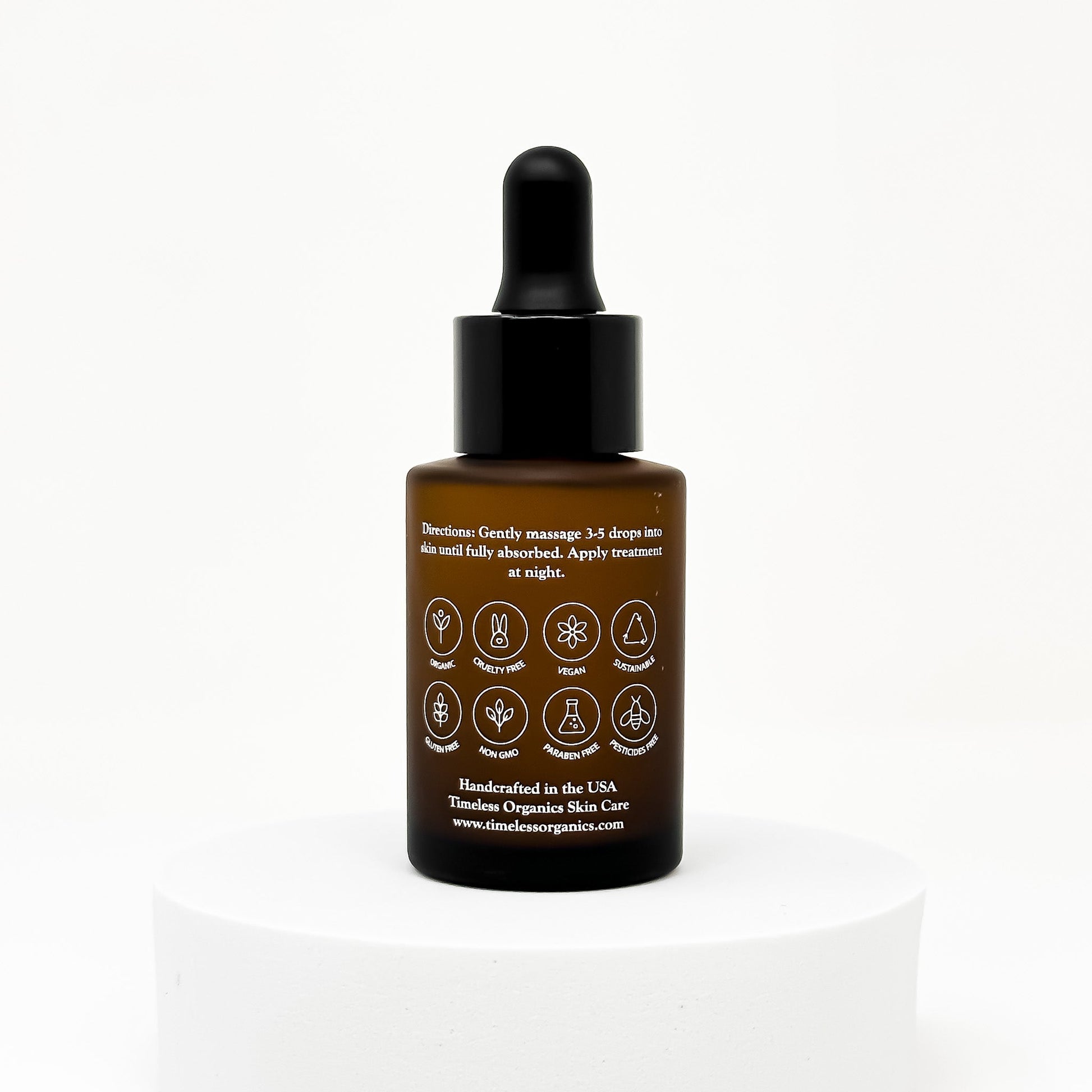 Retinol treatment serum bottle with black dropper cap and back label