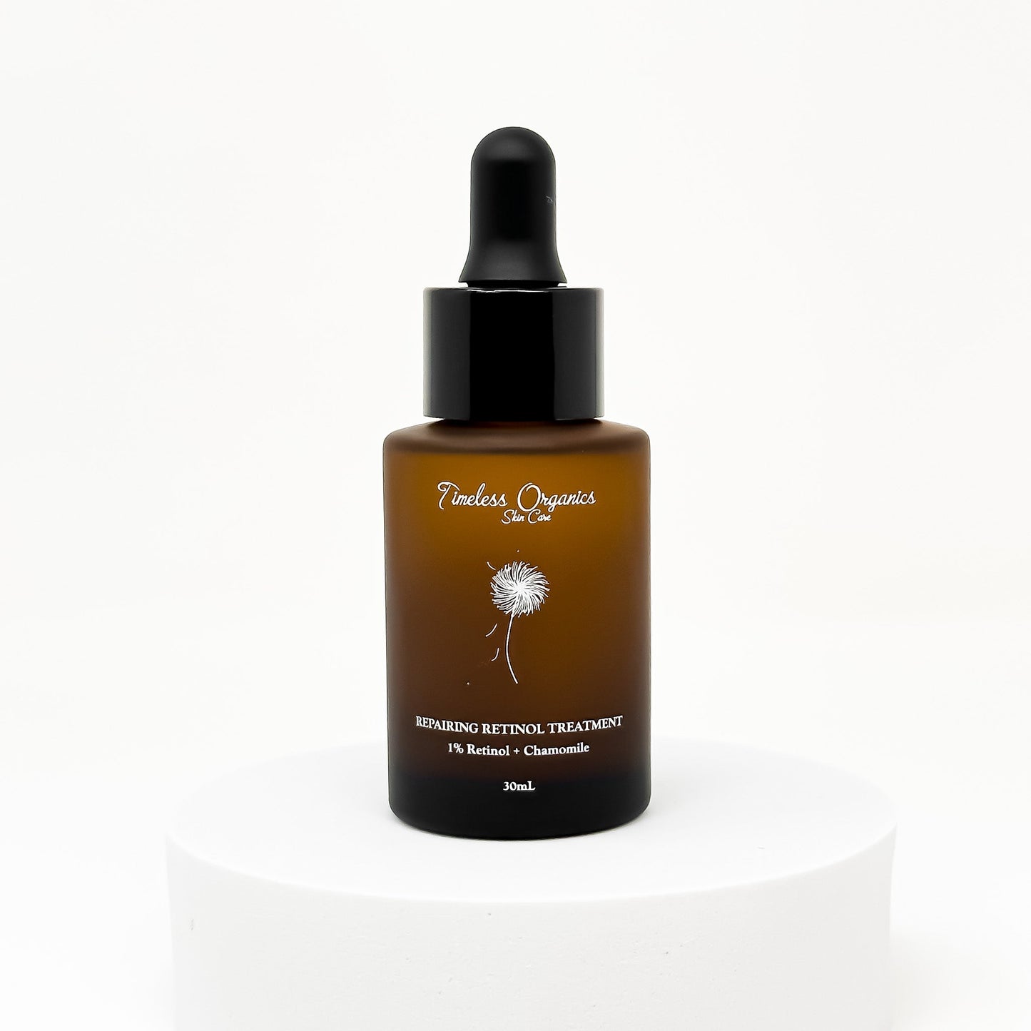 Retinol treatment serum bottle with black pump and amber glass