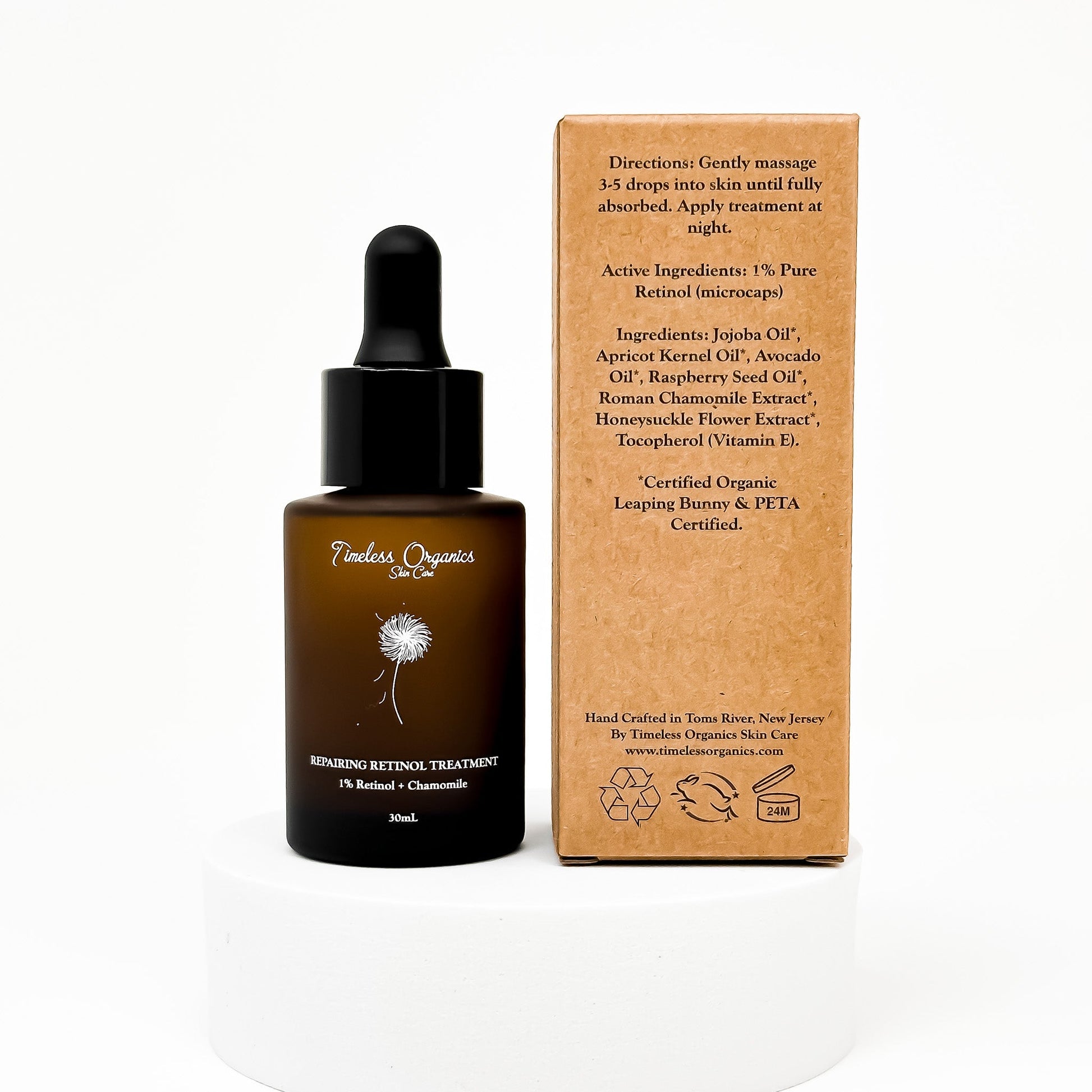 Retinol treatment serum bottle with black dropper cap and cardboard box