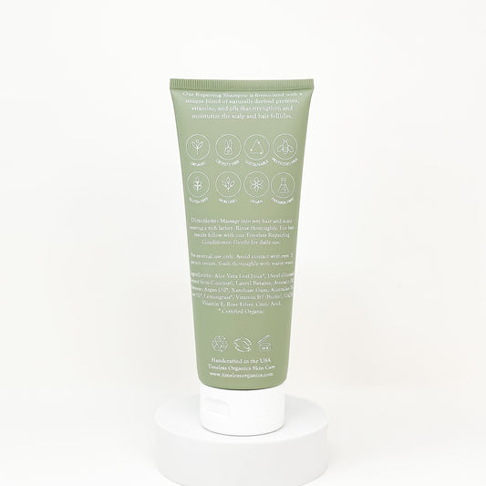 Timeless Organics repairing shampoo tube, green back with directions and ingredient icons