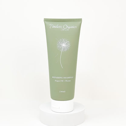 Timeless Organics repairing shampoo tube, green front with argan oil and biotin label