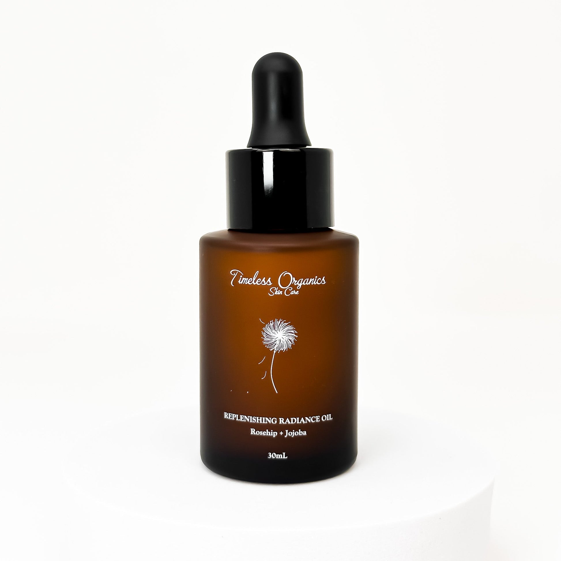 Face oil bottle with black dropper and amber glass, Timeless Organics label
