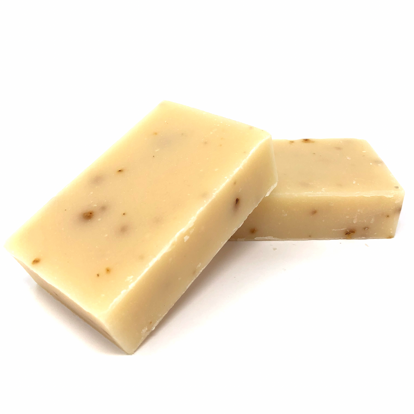 Exfoliating bar soap, cream with specks; two stacked soap blocks