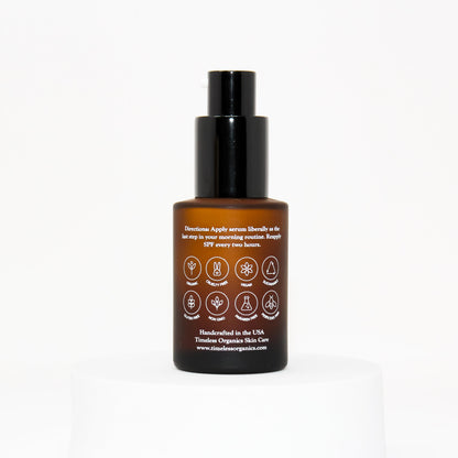 Sun defense serum SPF 30 bottle with black pump; amber glass back label.