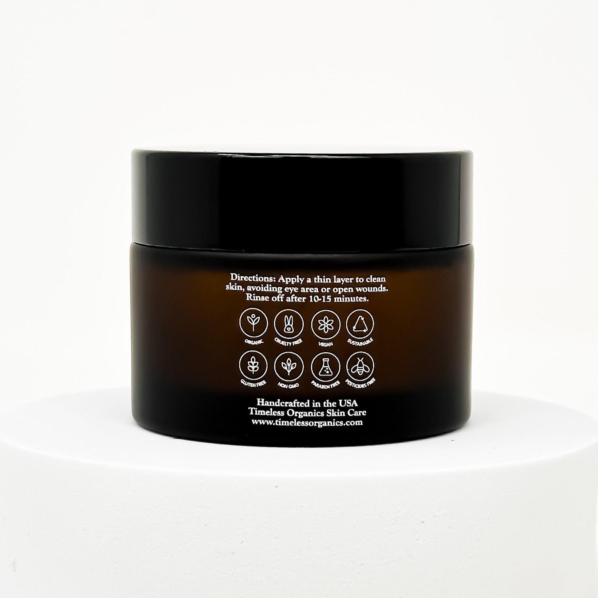 Tightening clay face mask jar with back panel showing directions and icons