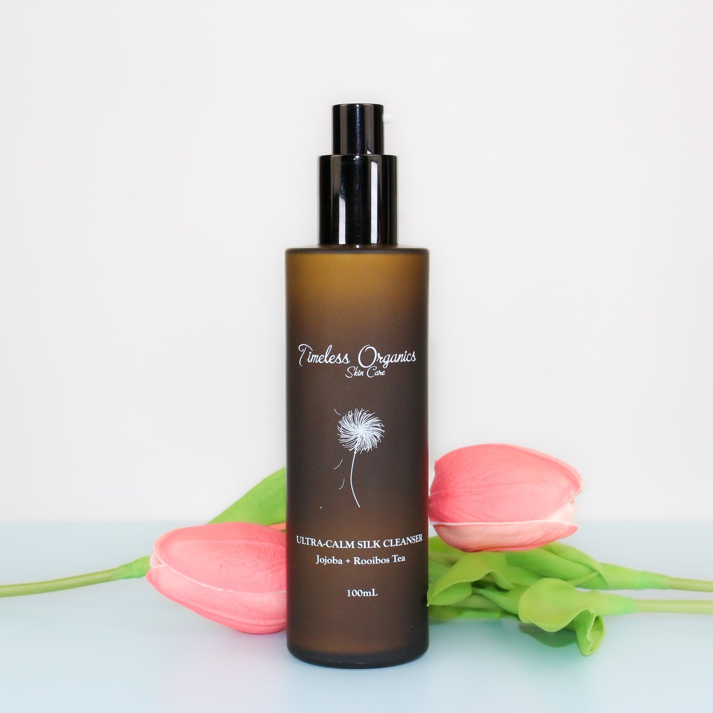 Timeless Organics silk cleanser bottle, amber frosted glass with black pump and label