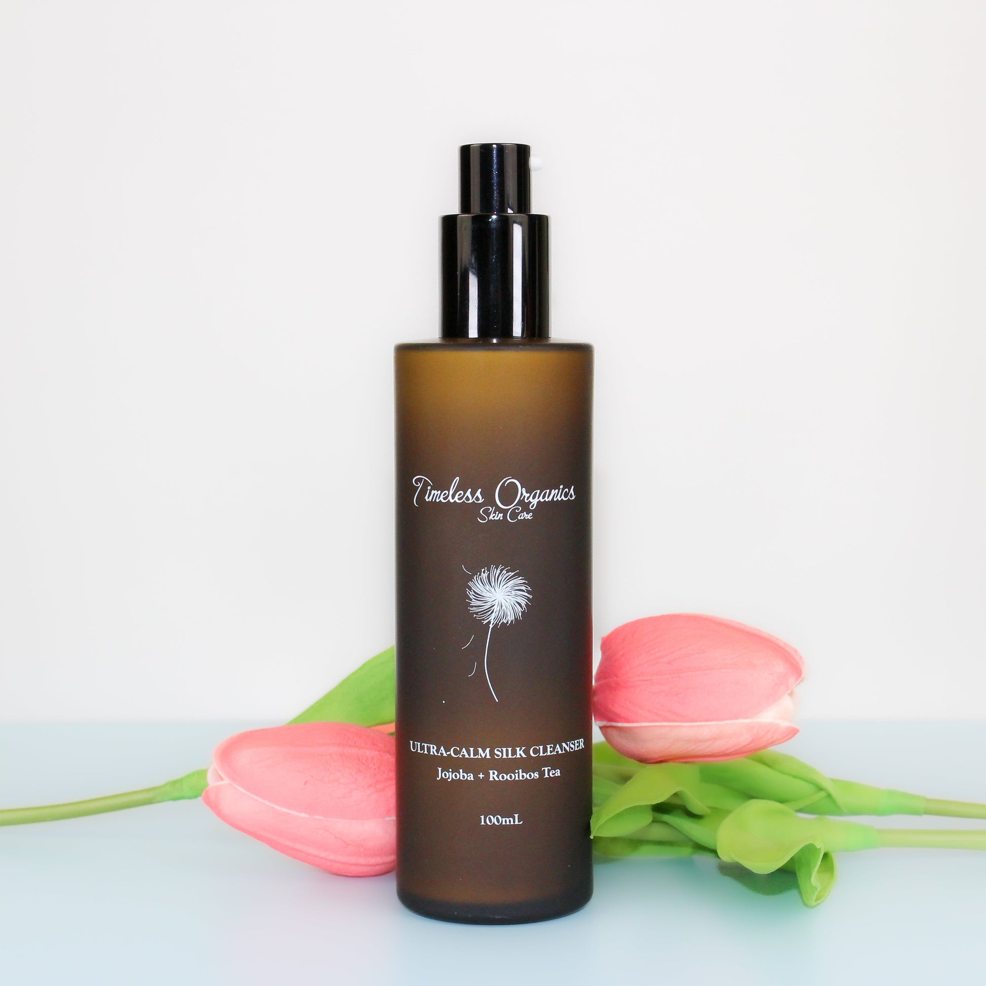 Timeless Organics silk cleanser bottle, amber frosted glass with black pump and label