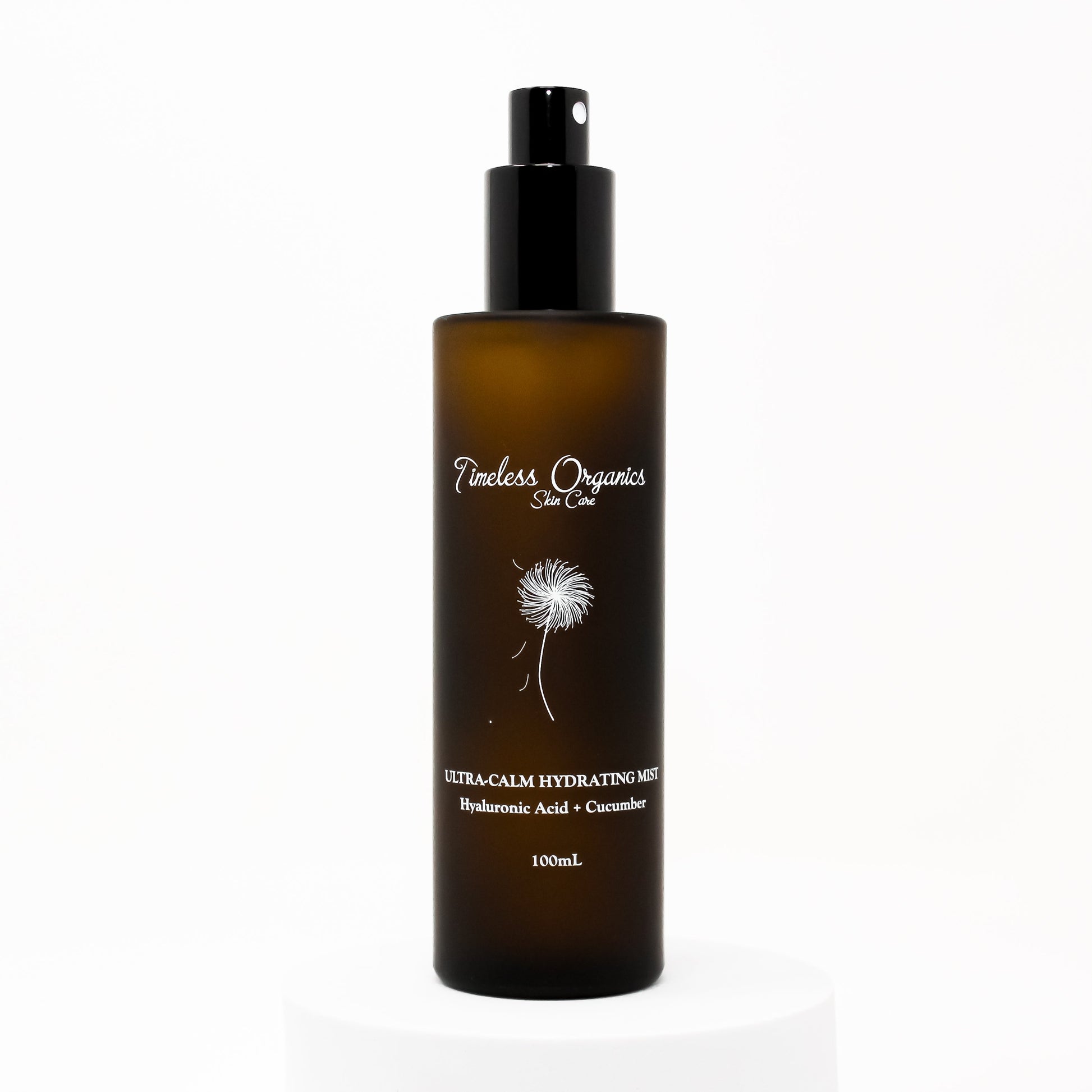 Hydrating face & body mist bottle with black pump, amber bottle, front label