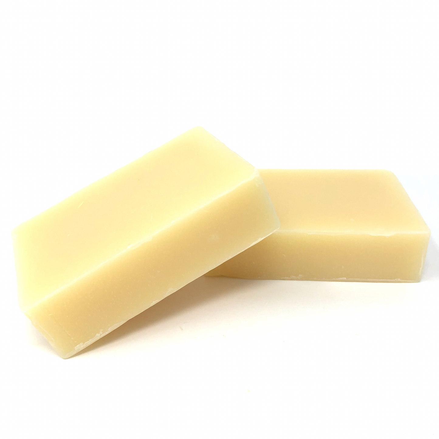 Creamy shaving soap bar, two stacked rectangular pieces with smooth edges
