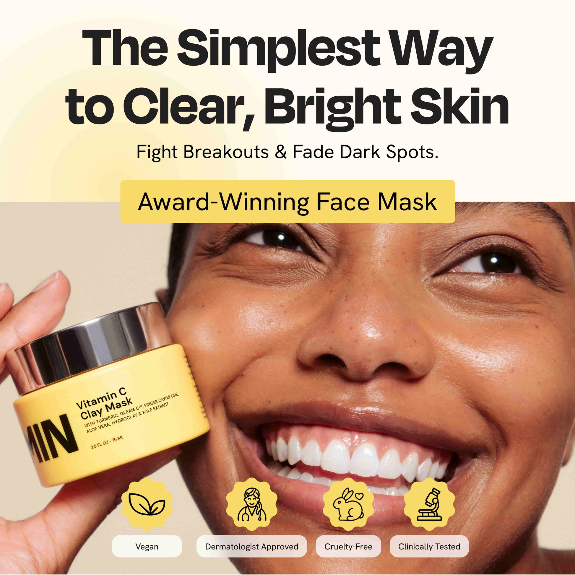 Yellow face mask jar with silver lid, beige clay mask texture shown
